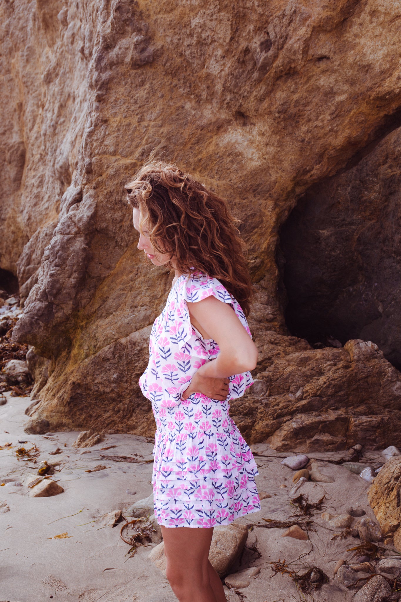 PLEATED SMOCKED MINI SKIRT IN FUSCHIA NAVY FLOWER